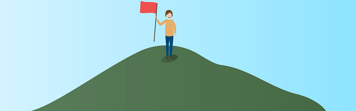 Business owner holding a flag on the top of a mountain