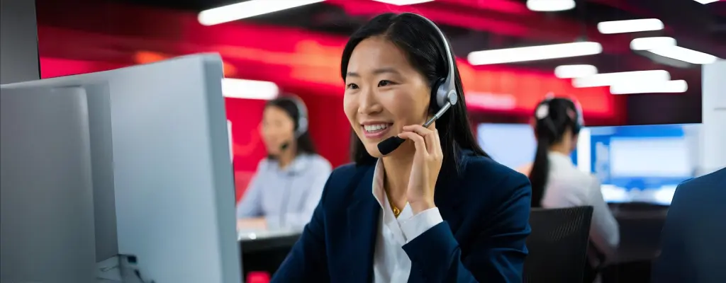 A contact center agent showing how BPO offers access to advanced technologies