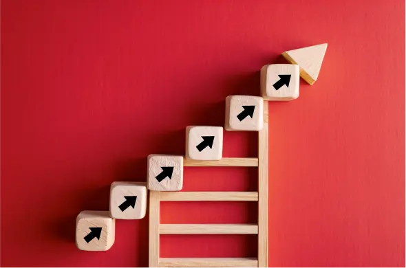 A ladder with arrows going up, signifying the benefits of outsourcing for small businesses