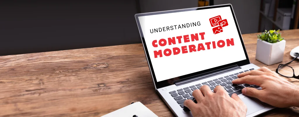 A laptop with text “understanding the importance of content moderation in social media”
