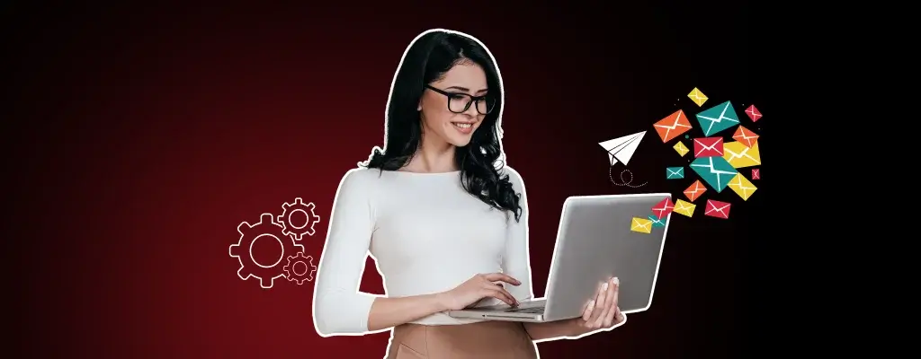 A woman smiles while holding a laptop with colorful email icons floating around it